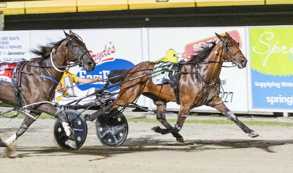 Nathan Jack steers Max Delight to a thrilling Group 1 Bendigo Pacing Cup victory at Lord's Raceway on Saturday night, staving off a fierce challenge from Serg Blanco. Picture by Stuart McCormick
