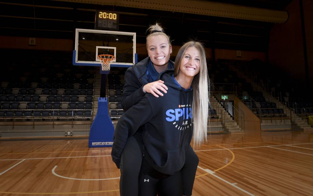 EXCITED: Carley Ernst will play her first WNBL regular season game for the Bendigo Spirit against the Melbourne Boomers tomorrow night (Saturday) at Bendigo Stadium. Ernst is pictured with fourth-year Spirit guard Kara Tessari. Pictures: NONI HYETT