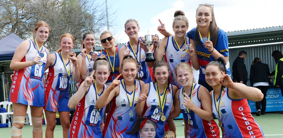 BULLDOGS ROAR: Gisborne's victorious 17-and under premiership team with their coaches Tarryn Rymer and Maddie Stewart. Picture: DARREN HOWE