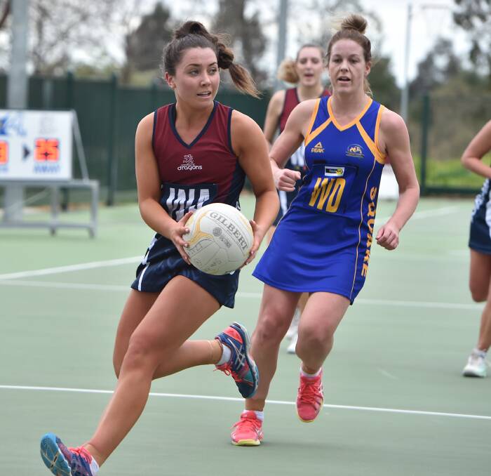 IN CONTROL: Sandhurst midcourter Meg Williams snares possession of the ball ahead of Golden Square's Holly Guerra during Saturday's clash at the QEO. Picture: NONI HYETT