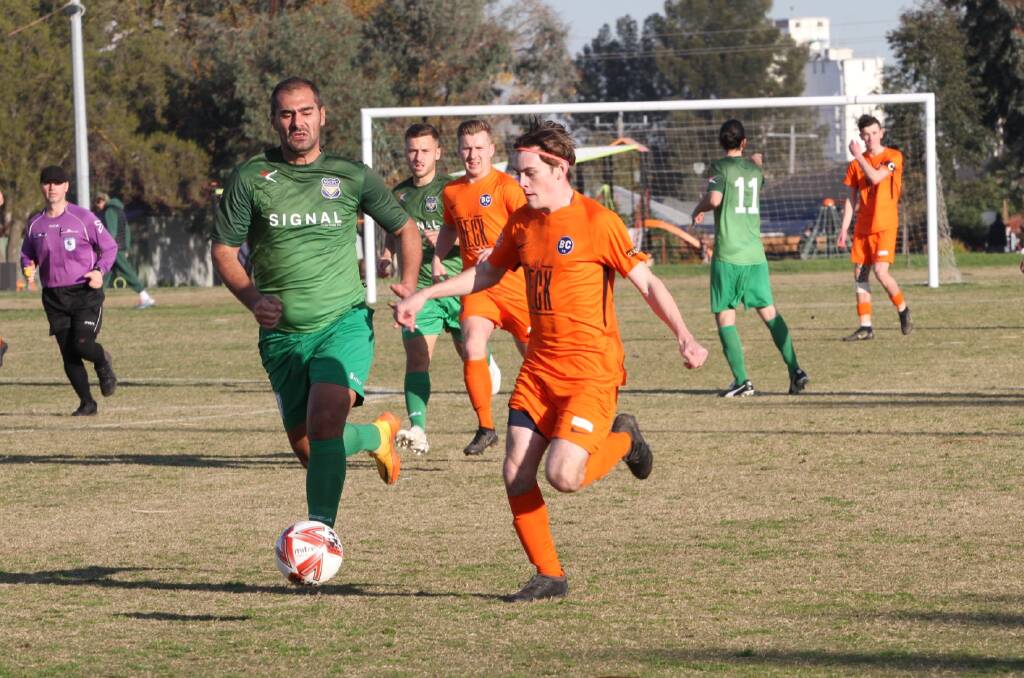 Lewis Merriman streams downfield against Maribyrnong Greens. Picture: COLIN NUTTALL