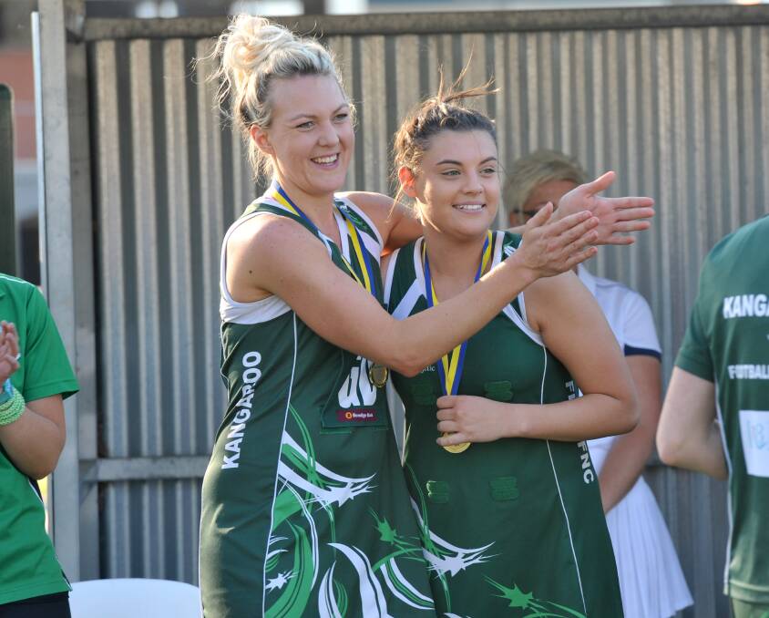 Alicia McGlashan and Chelsea Sartori celebrate after Kangaroo Flat's 2014 premiership win. Picture: JODIE DONNELLON