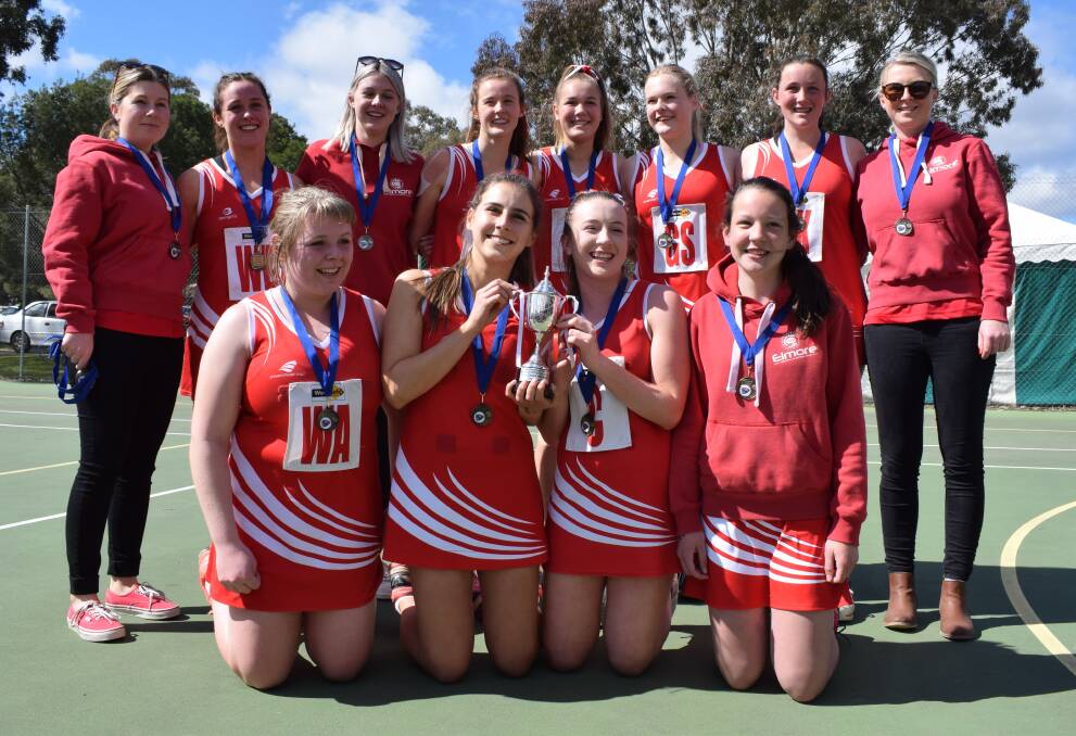 UPLIFTING: Elmore's victorious 17-and-under grand final team with coaches Hollie and Jess Hildebrandt. Picture: KIERAN ILES