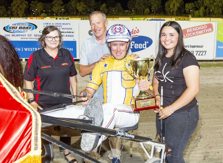 Trainer David Aiken and driver Nathan Jack celebrate their 2024 Bendigo Pacing Cup triumph with Max Delight. Picture by Stuart McCormick