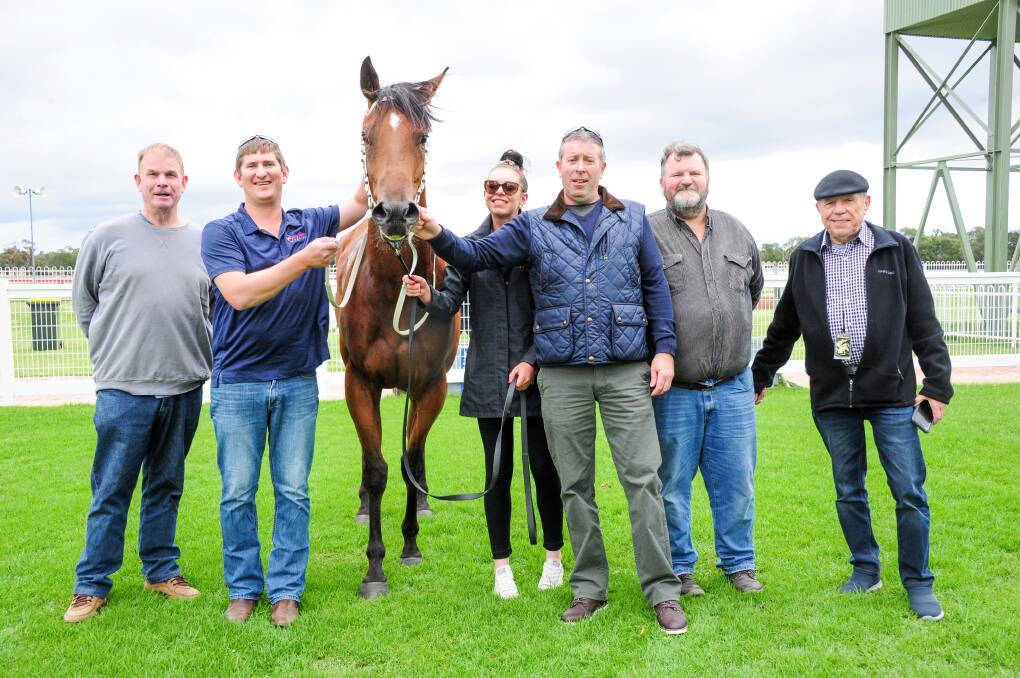 Trainer Kym Hann (second from left) and the connections of Rogue Star celebrate after Wednesday's win. Picture: BRENDAN McCARTHY/RACING P)HOTOS