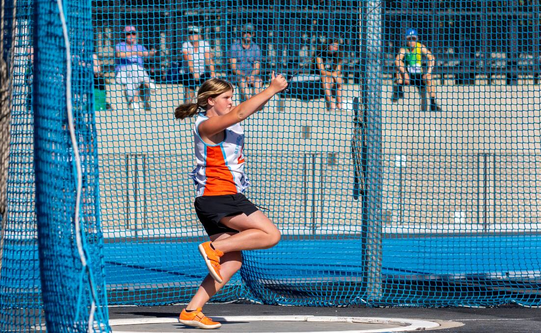 Hailey Stubbs winds up to hurl the hammer on her way to winning the under-15 title. Picture: JAZZ DEOL