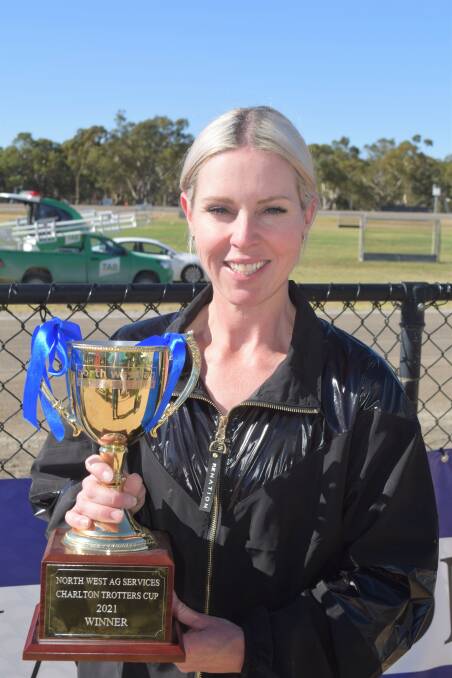 Kate Gath holds the 2021 Charlton Trotters Cup trophy, which was won by one of the stable's favourites McLovin. Gath had to settle for second in the Charlton Pacing Cup on Fourbigmen. Picture: KIERAN ILES