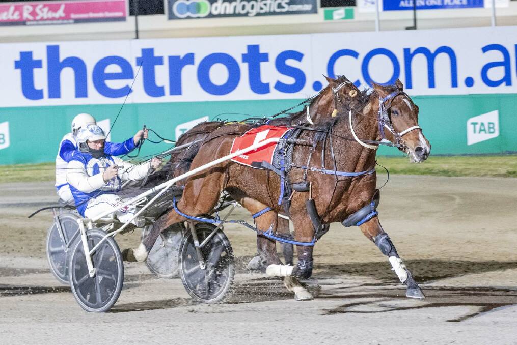 IN-FORM: Junior Feelgood, driven by Glenn Douglas, wins at Tabcorp Park Melton on Friday, July 16. The six-year-old gelding won three races during july for trainer Julie Douglas. Picture: STUART McCORMICK