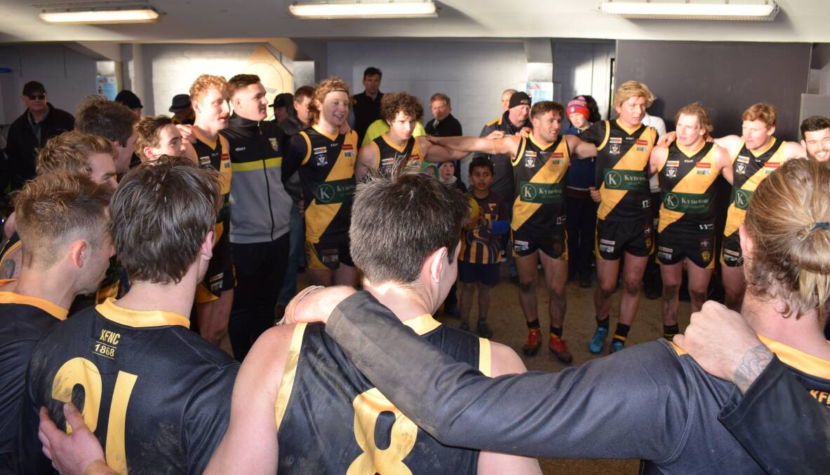 ON-SONG: Kyneton players belt out the theme song following Saturday's 51 point win against Maryborough at the Kyneton Showgrounds. The Tigers sealed the win with a five goal to one final quarter to run out winners 13.20 (98) to 6.11 (47). Picture: KIERAN ILES 