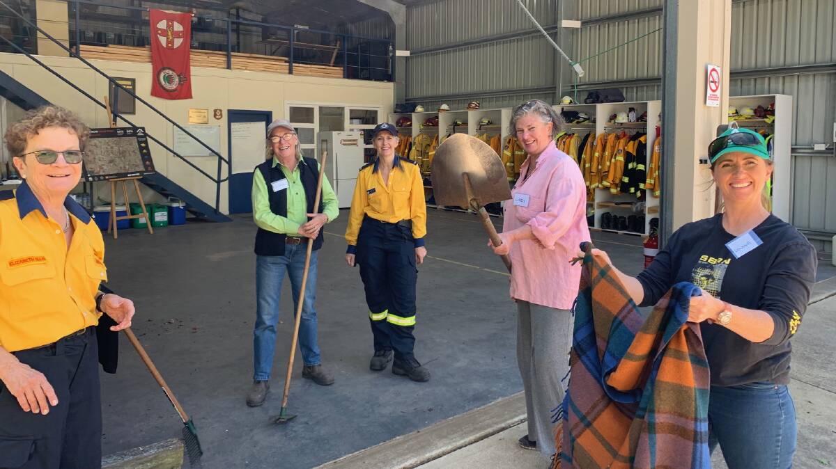 Burrawang Rural Fire Brigade Deputy Captain, Elizabeth Ellis and Brigade Training Officer Phillipa Drewett and several Burrawang residents at a previous fire preparation and firefighting skills workshop. Picture: Supplied