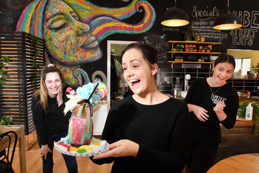 GREAT CAUSE: Vibe Street Eats owner Tara Hilson (front) with her staff members Katie Williamson and Chalina Moroney are donating $2 from every Freak Shake sold to Charlie's cause. Picture: NONI HYETT.