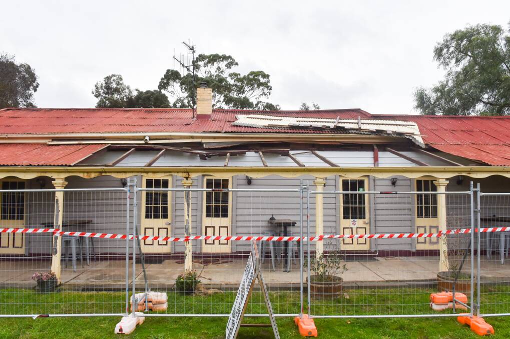 DAMAGE: The Axedale Tavern's verandah was damaged in the storm but locals came to help. Picture: DARREN HOWE
