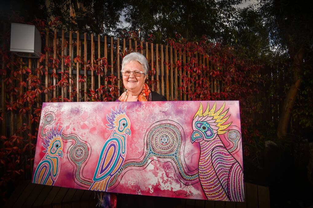 BRIGHT: Artist Robyn Davis with her artwork :Birds of a Feather' that will hang in Bendigo Hospital's children's ward. Picture: DARREN HOWE