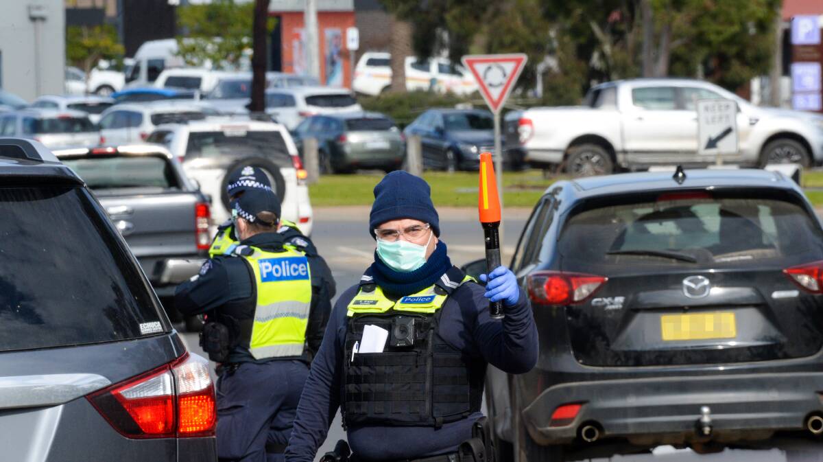 Victorian Police check drivers at the Echuca border. Picture: DARREN HOWE
