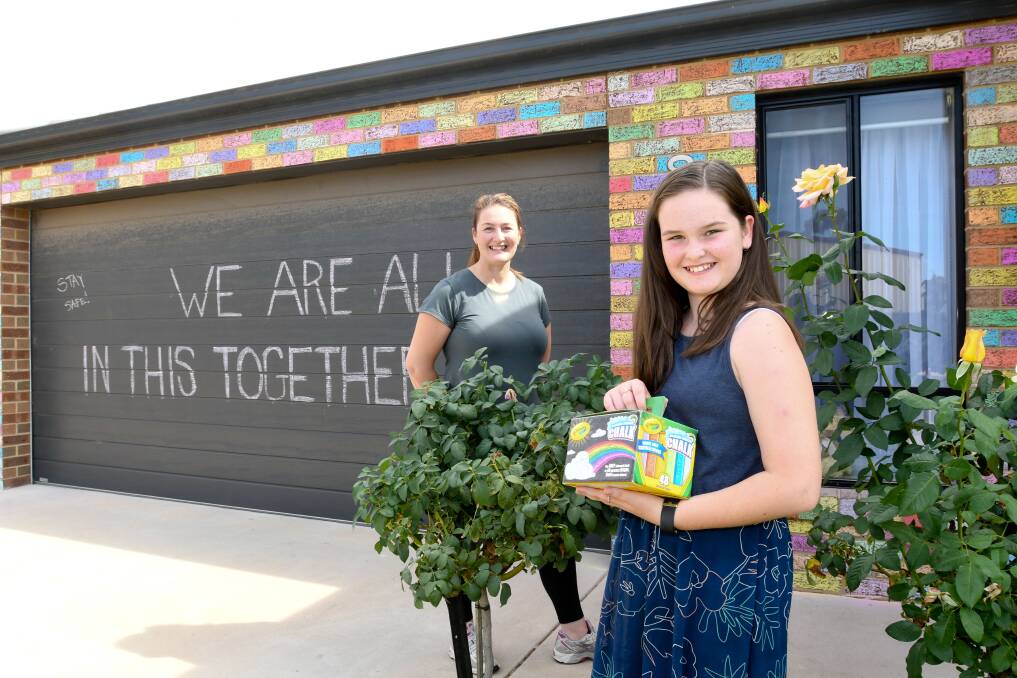 Lyndell French and daughter Paige coloured the front of their house with chalk in 2020. Share your good news stories with the Bendigo Advertiser team. Picture: NONI HYETT