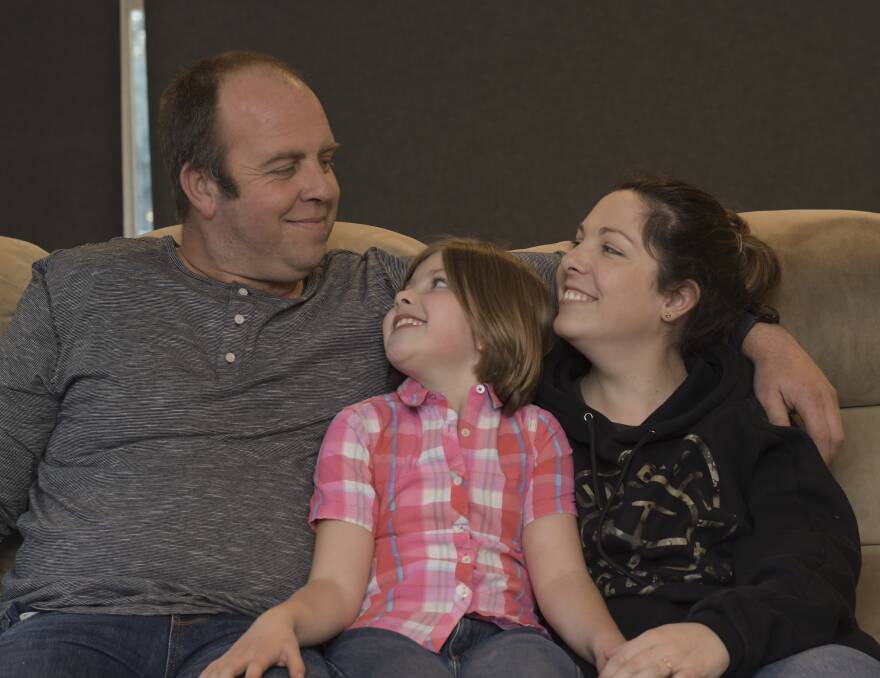 Adam Palmer, pictured with wife Megan and daughter Elizabeth, recently suffered a heart attack and is on the road to recovery. Picture: NONI HYETT