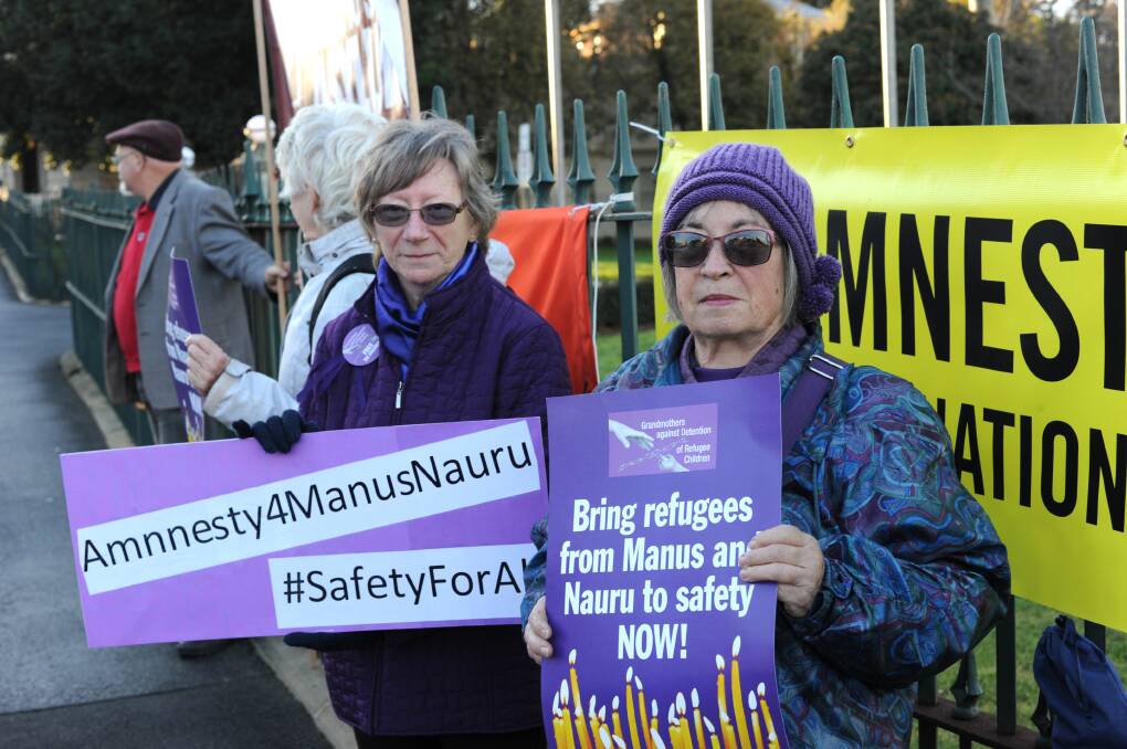 HELP OUT: A group of local refugee advocates took to Rosalind Park on Friday to mourn the death of a Manus Island detainee. Picture: NONI HYETT