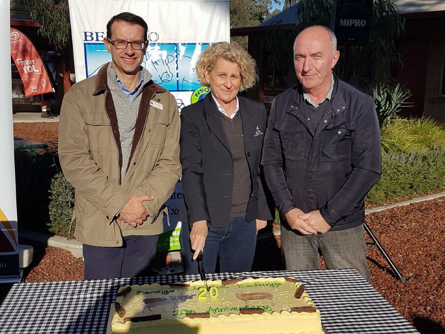 EAT CAKE: From left,  Bernie O'Sullivan, Director Strategy and Growth Kerrie Crowley, Livestock Exchange Manager (both City of Greater Bendigo staff) and councillor James Williams cut cake to celebrate the saleyards' 20th birthday.  