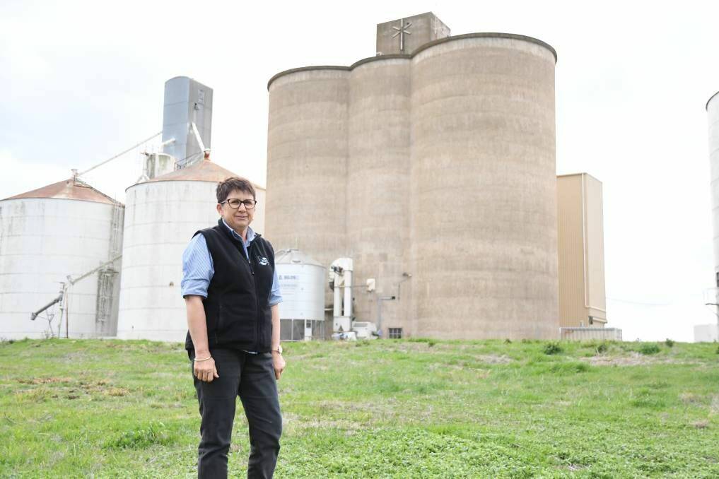 Carolyn Meyer from Vic Feeds is pictured in front of the silos which will become part of the silo art trail in regional Victoria.  Picture: ADAM HOLMES