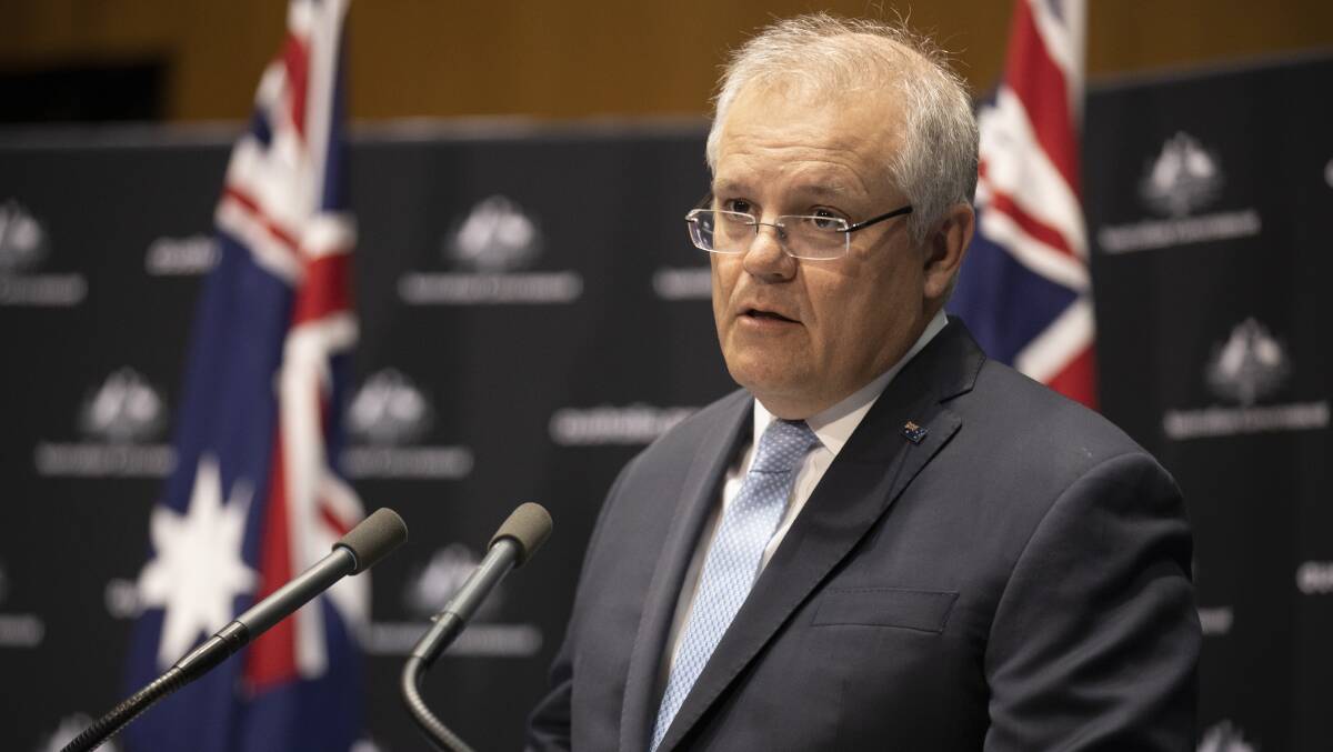 Prime Minister Scott Morrison announcing a major step towards lifting almost all restrictions on Friday. Picture: Sitthixay Ditthavong