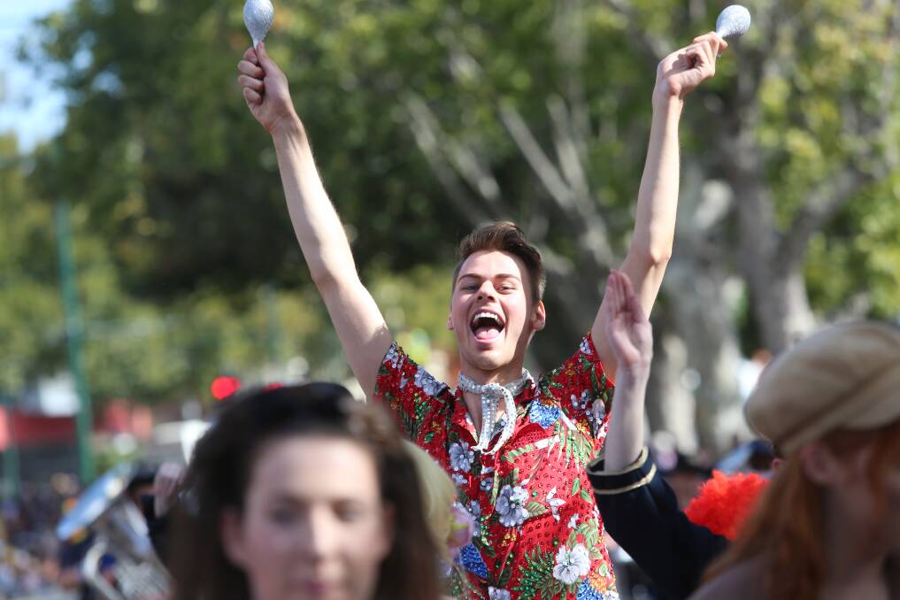 SHAKE IT: Bendigo Theatre Company performer Jordan French lets loose while taking part in the gala parade. Picture: DARREN HOWE