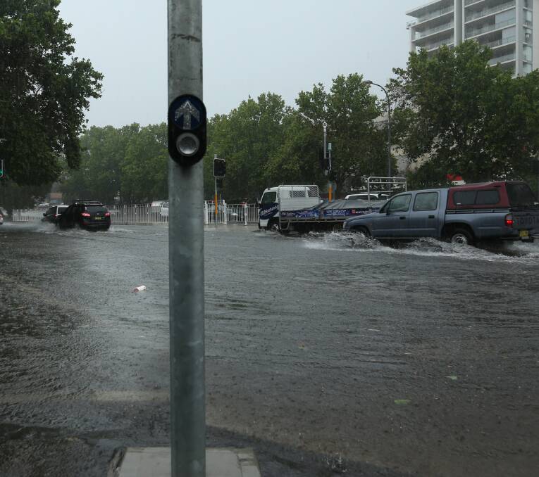 FLASH FLOODING: King Street was inundated during heavy rain around 9.30am on Monday. Picture: Simone De Peak