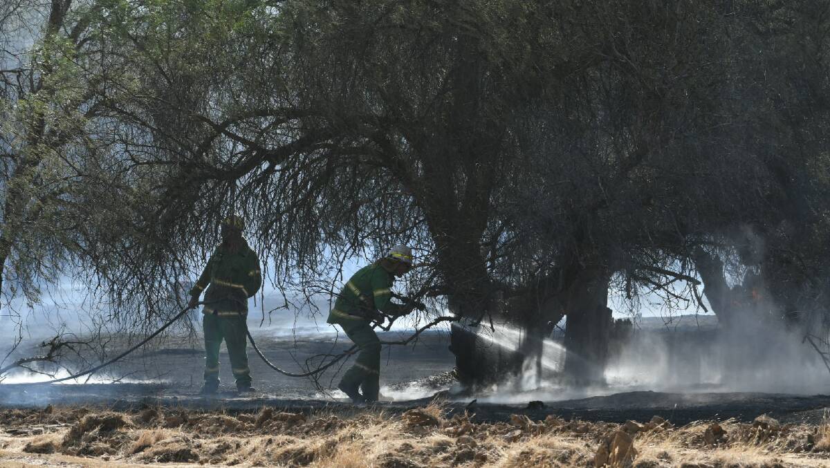 FIRE SEASON: Fire crews work to contain a Huntly fire in January 2020. Picture: DARREN HOWE