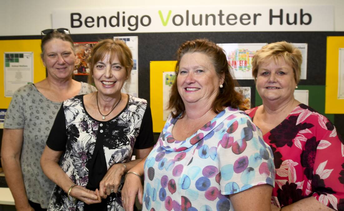 ADAPTED: The team at Bendigo Volunteer Resource Centre, photographed in February, including manager Helen Yorston (third from left). Picture: NONI HYETT 