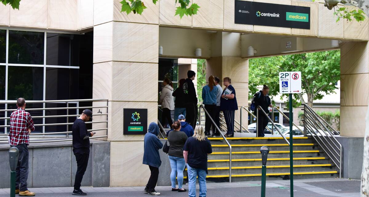 IN NEED: The onset of the coronavirus pandemic saw people queue at Bendigo's Centrelink office. Picture: BRENDAN MCCARTHY 
