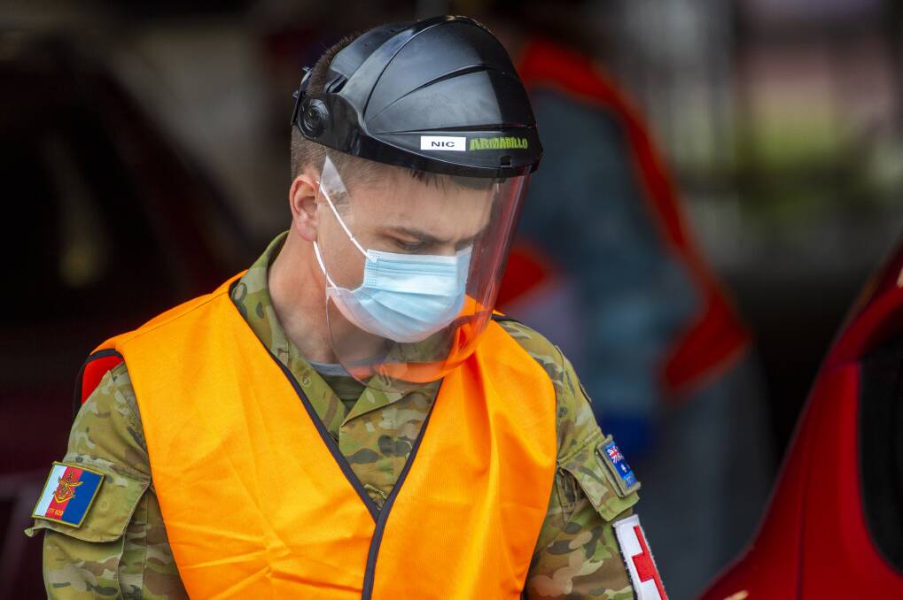 EXTRA HELP: A member of the Australian Defence Force working at Bendigo Health's drive thru COVID-19 screening clinic at Mercy Street. Picture: DARREN HOWE 
