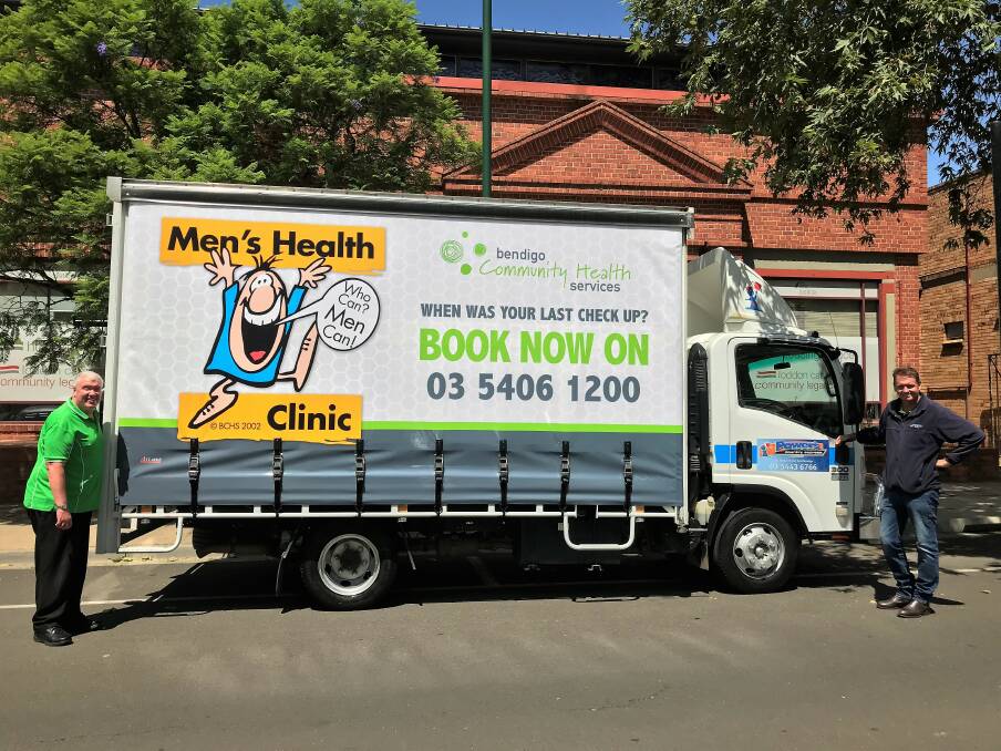 MESSAGE: Bendigo Community Health Services community engagement manager Rod Case and Power's Country Express owner Damien Power with the truck carrying the men's health message. Picture: Supplied. 