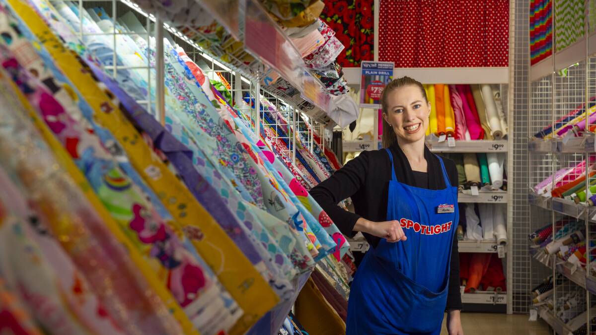 Spotlight Bendigo is donating and discounting fabric for the Gowns with Doctors initiative and Alysha Elliott has been more than glad to help out. Picture: DARREN HOWE