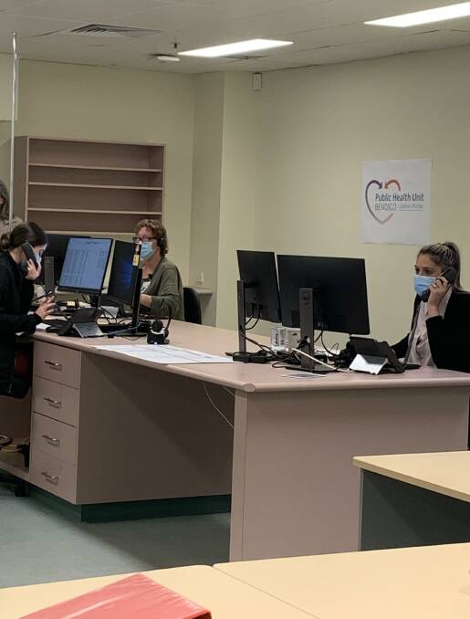 CALLS MADE: Members of Bendigo Health's contact tracing team at work on Tuesday. 
