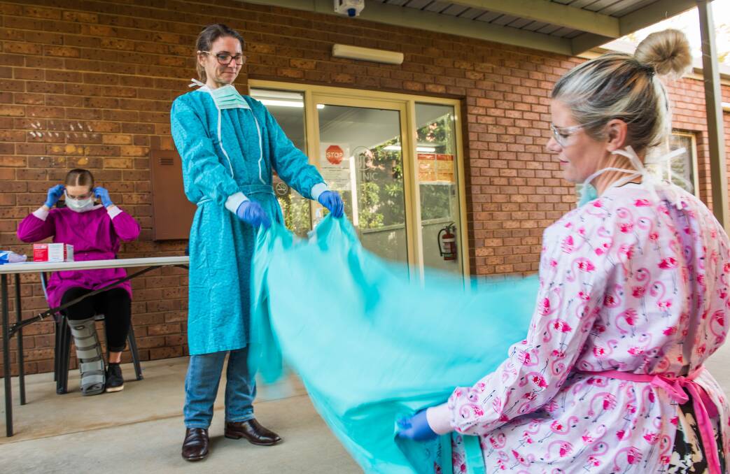 SEW GOOD: Dr Nicole Townsend and Dr Kirby White have been inundated with volunteers to help sew protective gowns. Picture: BRENDAN MCCARTHY 