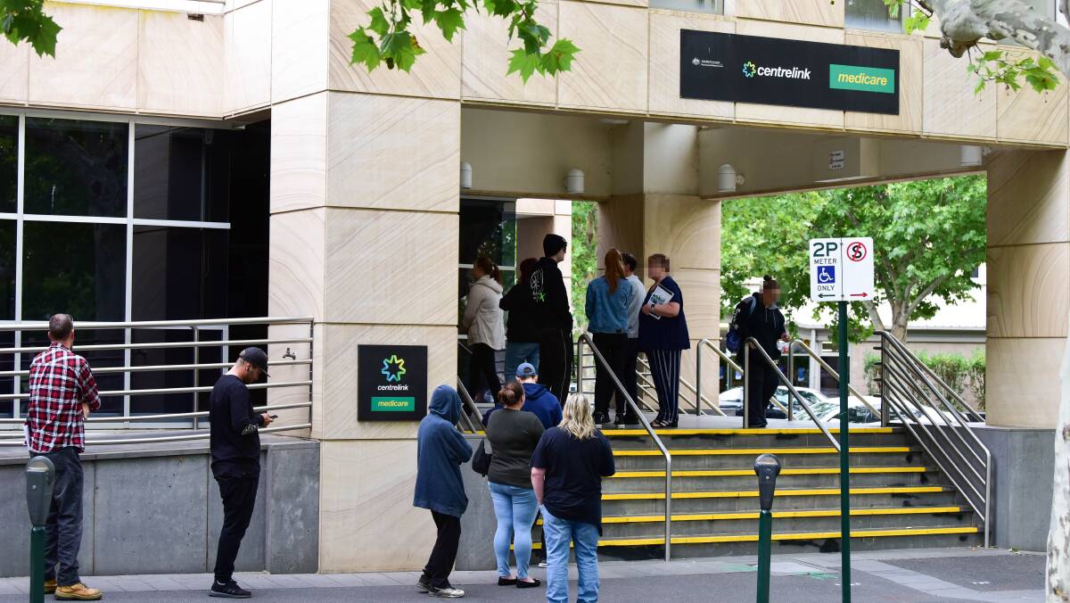 IMPACT: A queue formed outside Bendigo Centrelink in March when restrictions were first announced. Picture: BRENDAN MCCARTHY 