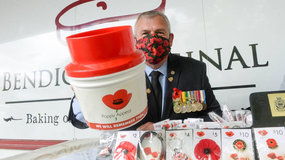 GOOD CAUSE: Bendigo's real estate agents have been selling poppies to raise funds for the Bendigo and District RSL. Picture: DARREN HOWE