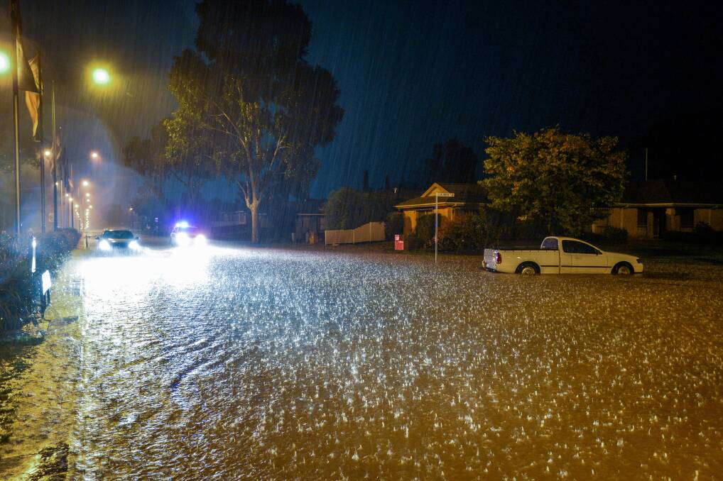 Flash flooding at the intersection of Lauren St & Calder Hwy, Kangaroo Flat. Picture: BRENDAN MCCARTHY