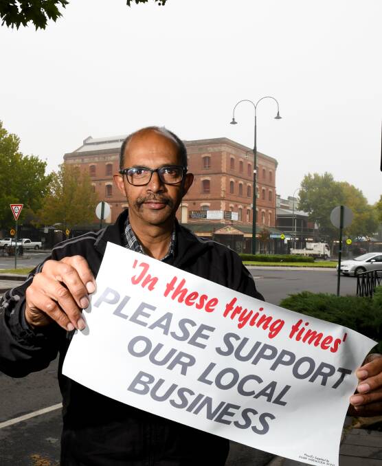Sign maker and former councillor Mark Weragoda's offer of free signs for local businesses has received lots of support. Picture: NONI HYETT