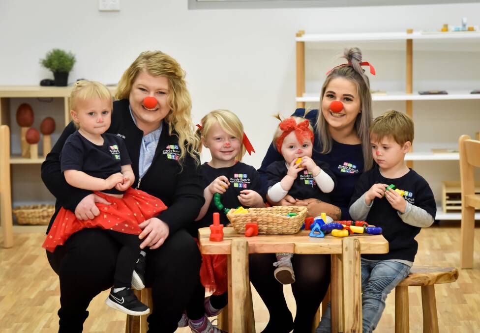 RED NOSE: Early learning teachers Jayde Zouwer and Elysha Pearce with students Addilyn, Addison, Boston and Asher. Picture: BRENDAN MCCARTHY. 