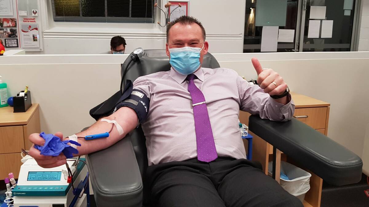 DONATION: PH Property real estate agent Darren Waters donating blood recently. Picture: Supplied. 