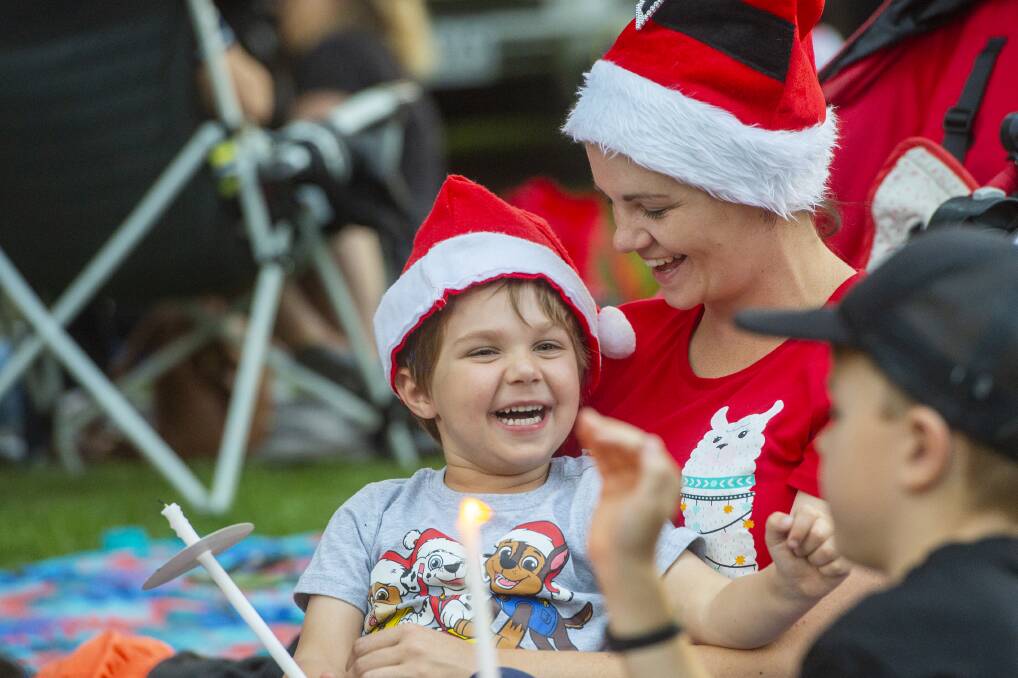 JOY: Families enjoyed the 2019 Carols by Candlelight in Rosalind Park. Picture: DARREN HOWE