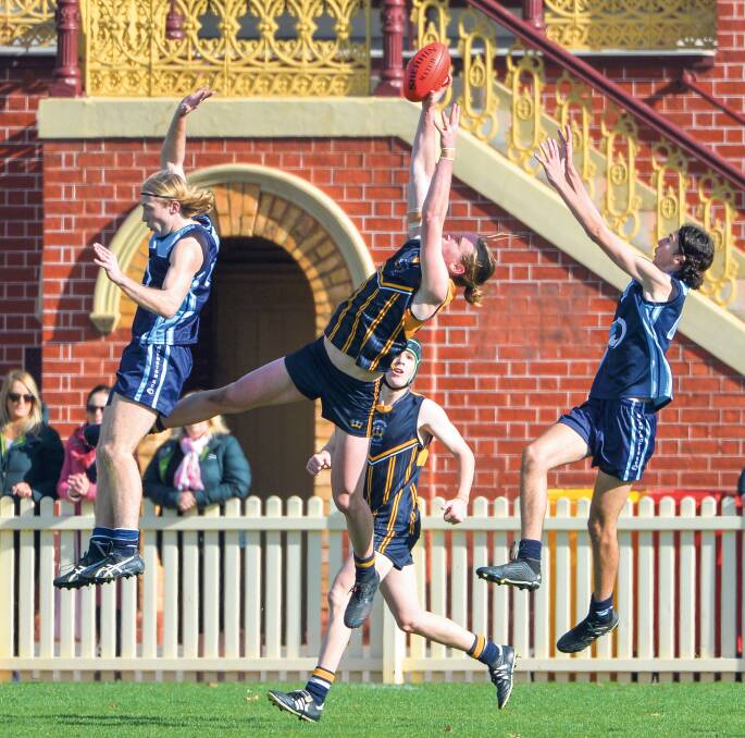 Players reached for the sky in schoolboy footy at the Queen Elizabeth Oval this season. 