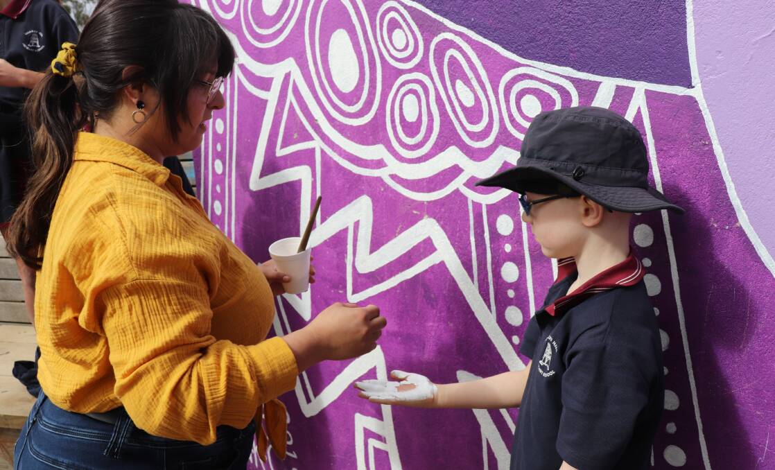 Making a mark: Local artist Natasha Carter and Quarry Hill Primary School student Dyson.