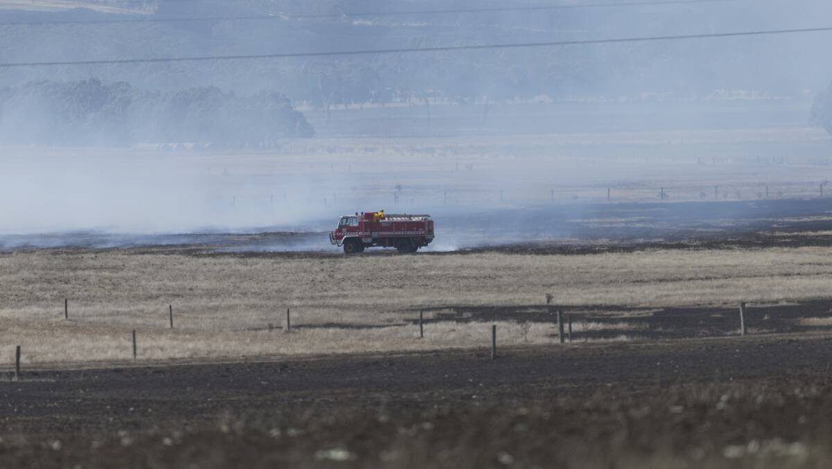 A lone CFA truck surveys burnt ground near Terang. Picture: Paul Jeffers
