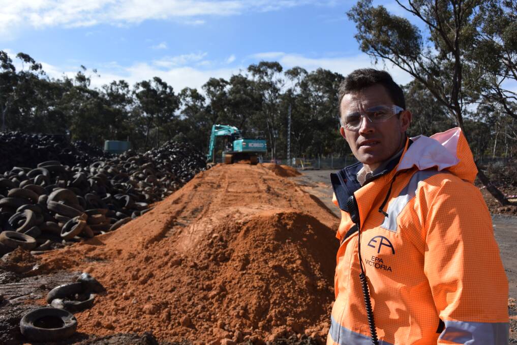 Environmental Protection Authority Stawell tyre intervention project manager Danny Childs with the millions of tyres at the site on Wednesday. Picture: REX MARTINICH 