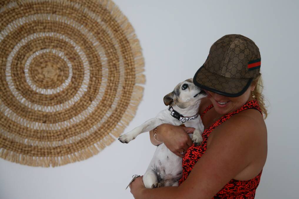 Michelle Robinson reunited with her dog, Suzie. Picture: Jonathan Carroll