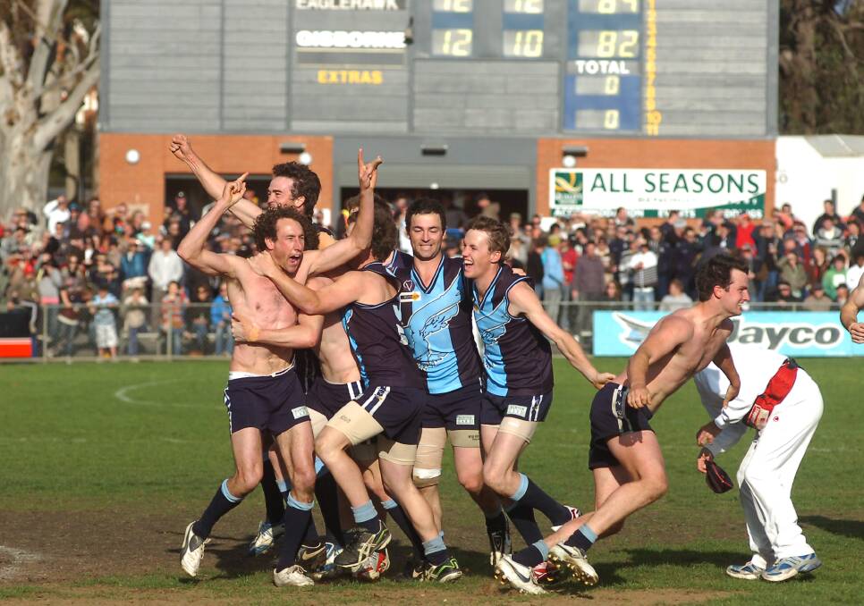 Eaglehawk players embrace after the final siren of the 2007 grand final.