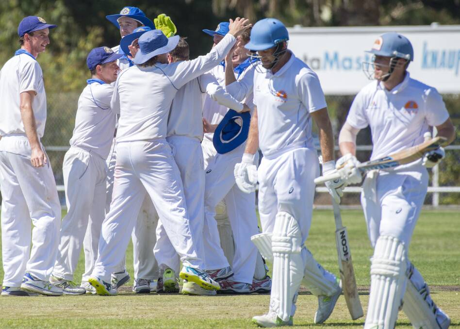 Golden Square players celebrate the crucial wicket of Andrew Chalkley. Picture: DARREN HOWE