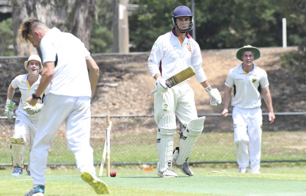 MIDDLE PEG: Spring Gully's James Fox claims the wicket of Maiden Gully Marist's Alex Gorrie. Picture: NONI HYETT