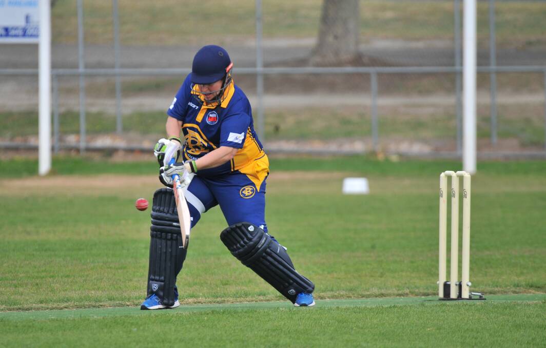Bendigo's Andrea Lima belts a boundary in her innings of 14 not out against Strathdale. Picture: ADAM BOURKE